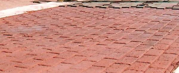 Stamped concrete surface with a brick-shaped decorative pattern